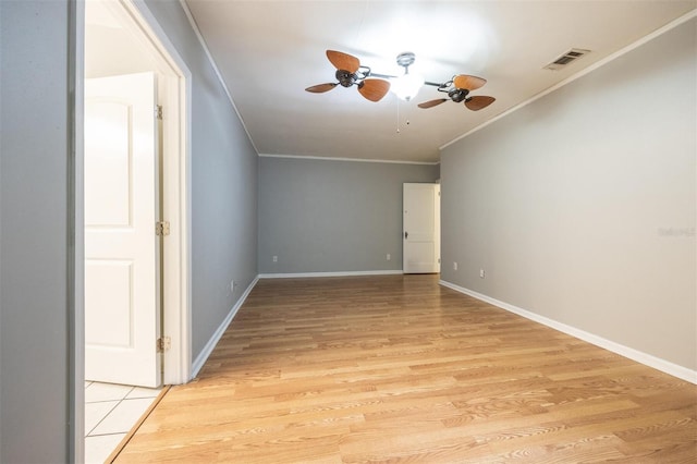 1404 NW 10th Ave, Gainesville, FL 32605 - unfurnished room featuring ornamental molding, ceiling fan, and light wood finished floors