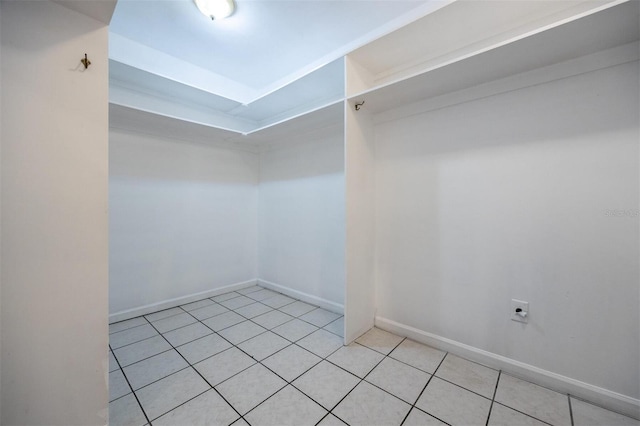 1404 NW 10th Ave, Gainesville, FL 32605 - spacious closet with light tile patterned flooring and a tray ceiling