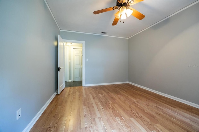 1404 NW 10th Ave, Gainesville, FL 32605 - empty room featuring crown molding, light wood-type flooring, and a ceiling fan
