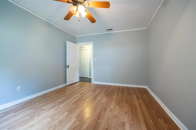 1404 NW 10th Ave, Gainesville, FL 32605 - unfurnished room with crown molding, wood finished floors, and a ceiling fan