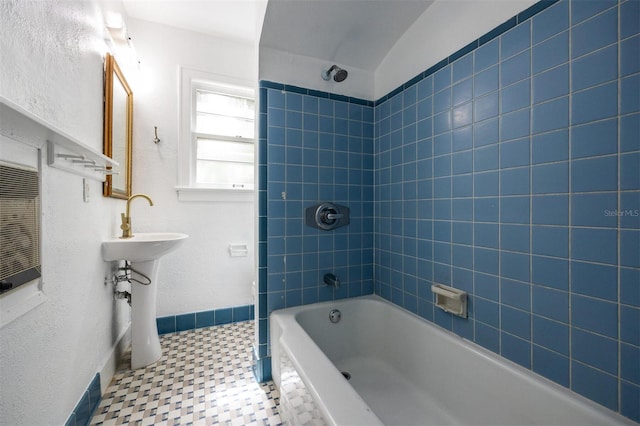 1404 NW 10th Ave, Gainesville, FL 32605 - bathroom featuring bathtub / shower combination and a sink