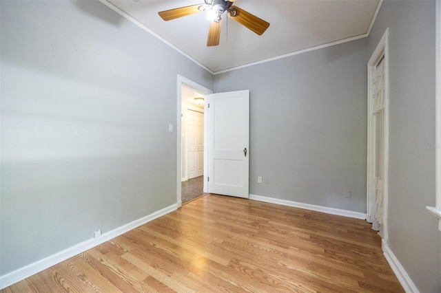 1404 NW 10th Ave, Gainesville, FL 32605 - unfurnished bedroom featuring ornamental molding, light wood-type flooring, and ceiling fan