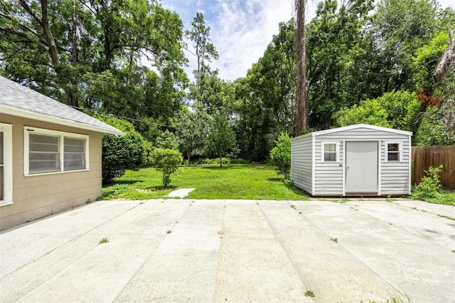 1404 NW 10th Ave, Gainesville, FL 32605 - view of patio / terrace featuring a storage shed and view of scattered trees