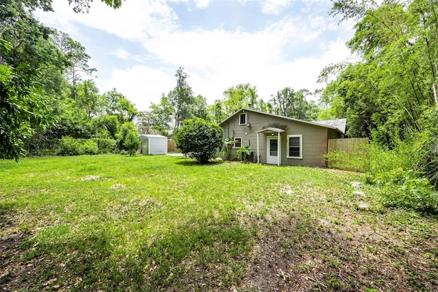 1404 NW 10th Ave, Gainesville, FL 32605 - view of yard featuring a storage unit