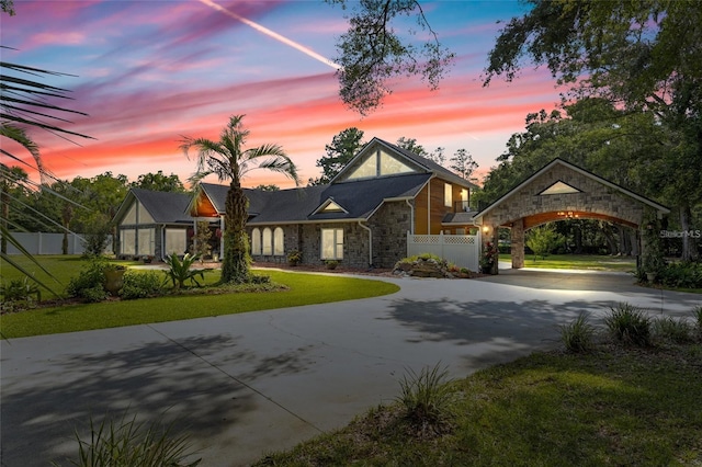 518 SW Little Rd, Lake City, FL 32024 - tudor home featuring stone siding and curved driveway