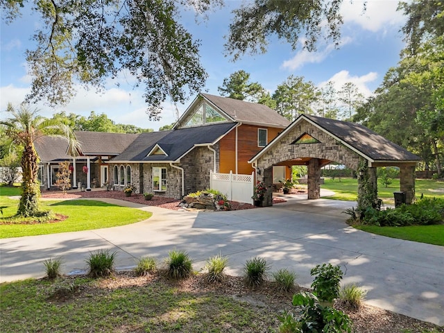 518 SW Little Rd, Lake City, FL 32024 - view of front of house with stone siding and curved driveway