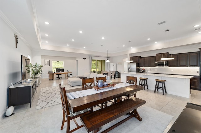 5604 SW 215th Ter, Newberry, FL 32669 - dining area featuring light tile patterned flooring, ornamental molding, and recessed lighting