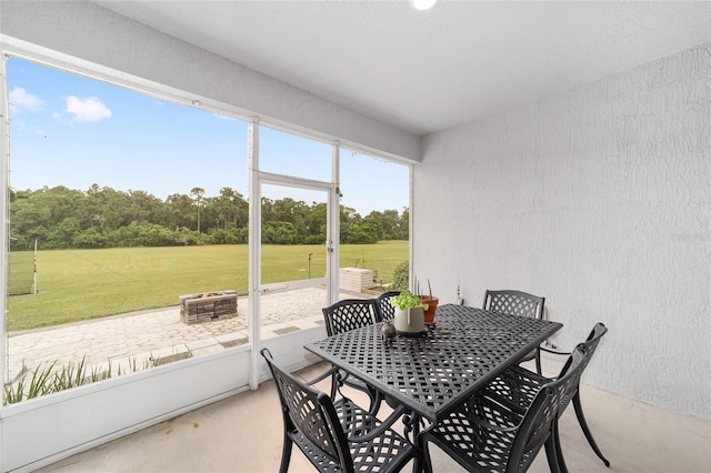 5604 SW 215th Ter, Newberry, FL 32669 - sunroom with a fire pit and outdoor dining space