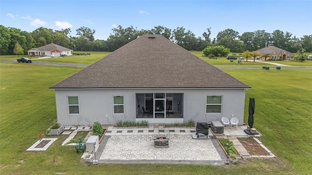 5604 SW 215th Ter, Newberry, FL 32669 - back of house with a patio, an outdoor fire pit, stucco siding, and a lawn