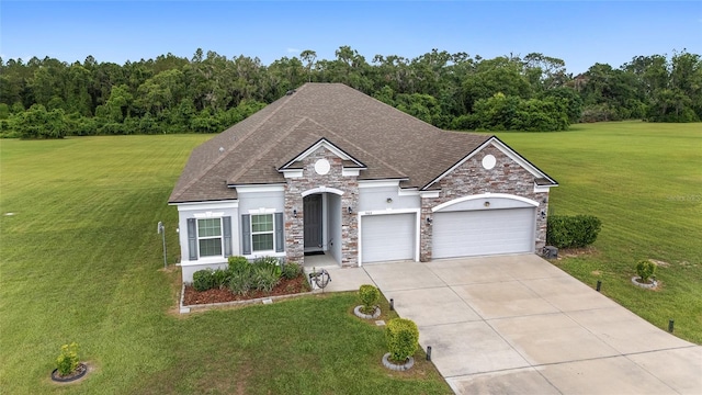 5604 SW 215th Ter, Newberry, FL 32669 - view of front facade with stone siding, stucco siding, concrete driveway, a garage, and a front lawn