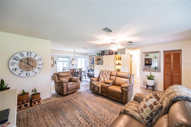 261 Ishie Ave, Bronson, FL 32621 - living area featuring a ceiling fan and a textured ceiling