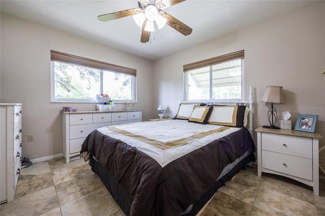 261 Ishie Ave, Bronson, FL 32621 - bedroom with a textured ceiling and ceiling fan