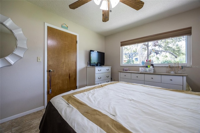 261 Ishie Ave, Bronson, FL 32621 - bedroom featuring a textured ceiling and a ceiling fan