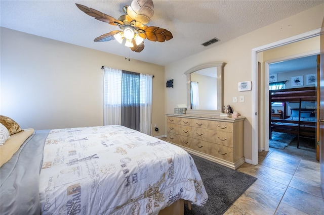 261 Ishie Ave, Bronson, FL 32621 - bedroom featuring a textured ceiling and a ceiling fan