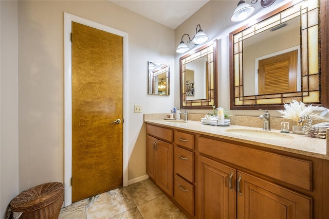 261 Ishie Ave, Bronson, FL 32621 - full bathroom with double vanity and tile patterned floors