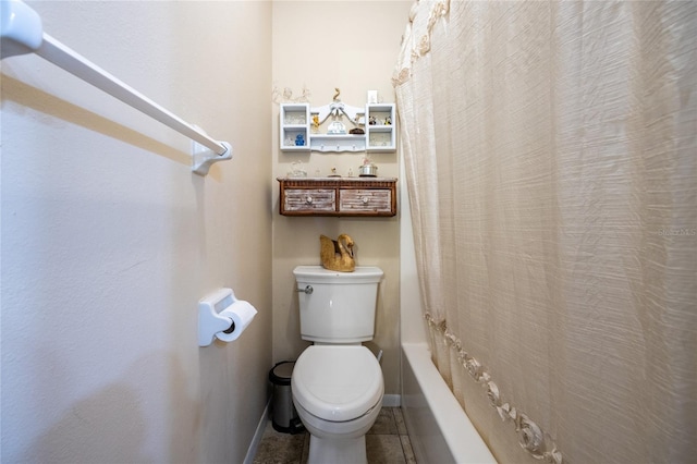 261 Ishie Ave, Bronson, FL 32621 - bathroom with shower / bath combo with shower curtain and tile patterned floors
