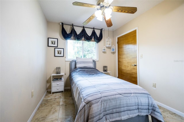 261 Ishie Ave, Bronson, FL 32621 - bedroom with baseboards and ceiling fan