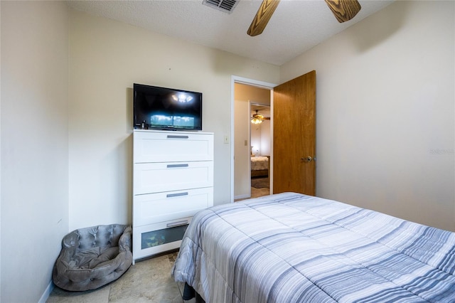 261 Ishie Ave, Bronson, FL 32621 - bedroom with a textured ceiling and a ceiling fan