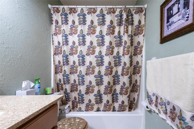 261 Ishie Ave, Bronson, FL 32621 - bathroom featuring a textured wall, vanity, and shower / bath combination with curtain