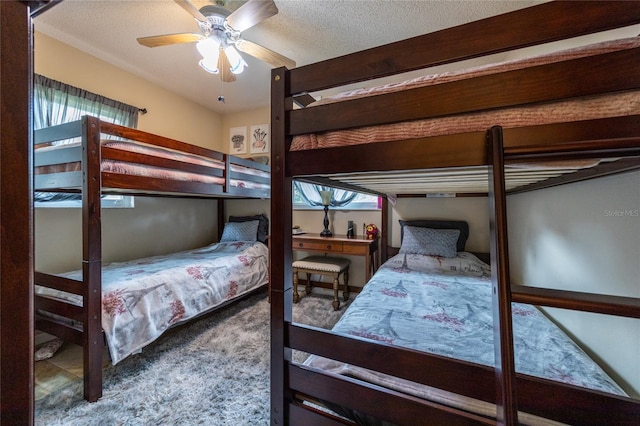 261 Ishie Ave, Bronson, FL 32621 - bedroom featuring carpet floors, a textured ceiling, and a ceiling fan
