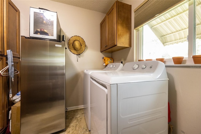 261 Ishie Ave, Bronson, FL 32621 - laundry area with washer and clothes dryer and cabinet space