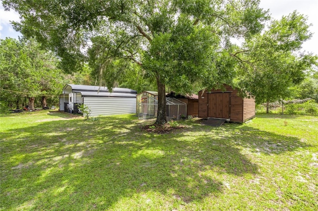 261 Ishie Ave, Bronson, FL 32621 - view of grassy yard featuring a storage shed
