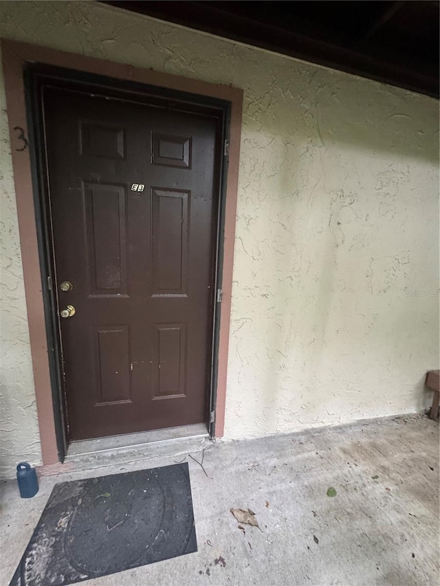 1515 NW 29th Rd Unit E3, Gainesville, FL 32605 - property entrance with stucco siding