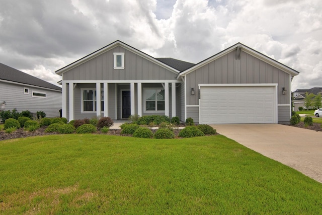 3520 SW 120th Dr, Gainesville, FL 32608 - view of front facade with board and batten siding, a front yard, and an attached garage