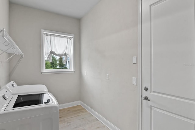 3520 SW 120th Dr, Gainesville, FL 32608 - laundry room featuring washing machine and clothes dryer and light wood-style floors