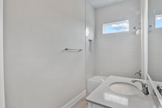 3520 SW 120th Dr, Gainesville, FL 32608 - full bath with bathtub / shower combination, vanity, and wood finished floors