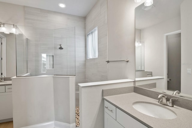 3520 SW 120th Dr, Gainesville, FL 32608 - bathroom with vanity, walk in shower, and recessed lighting