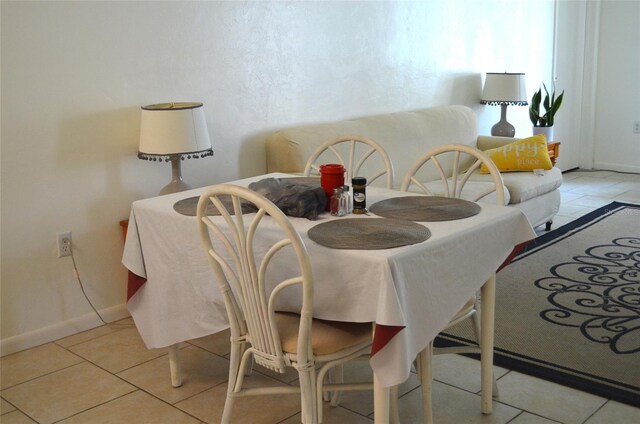3800 SW 20th Ave Unit 405, Gainesville, FL 32607 - tiled dining room featuring baseboards