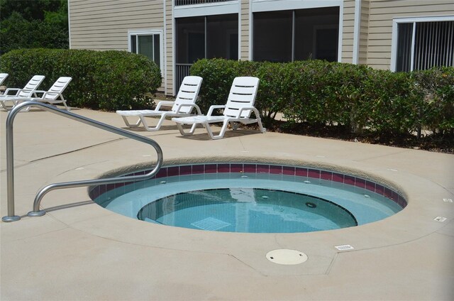 3800 SW 20th Ave Unit 405, Gainesville, FL 32607 - view of swimming pool featuring a hot tub and a patio area