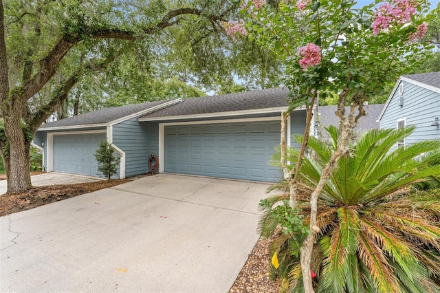 5328 NW 9th Ln, Gainesville, FL 32605 - view of front facade featuring a garage and a shingled roof