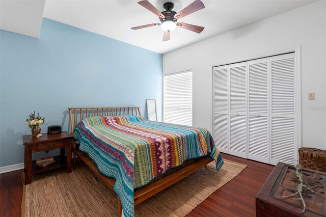5328 NW 9th Ln, Gainesville, FL 32605 - bedroom featuring wood finished floors, a closet, baseboards, and a ceiling fan