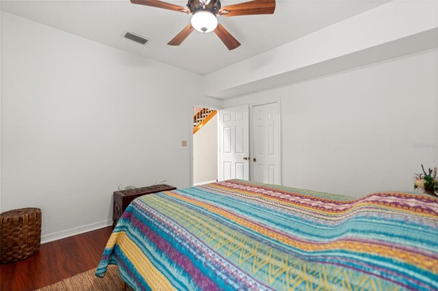 5328 NW 9th Ln, Gainesville, FL 32605 - bedroom featuring wood finished floors, baseboards, and ceiling fan