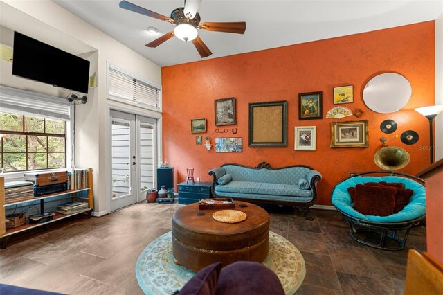 5328 NW 9th Ln, Gainesville, FL 32605 - living area with a ceiling fan and baseboards