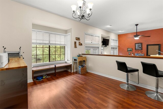 5328 NW 9th Ln, Gainesville, FL 32605 - kitchen with baseboards, wood finished floors, a chandelier, and ceiling fan