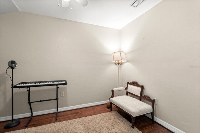 5328 NW 9th Ln, Gainesville, FL 32605 - living area featuring wood finished floors, vaulted ceiling, a ceiling fan, and baseboards