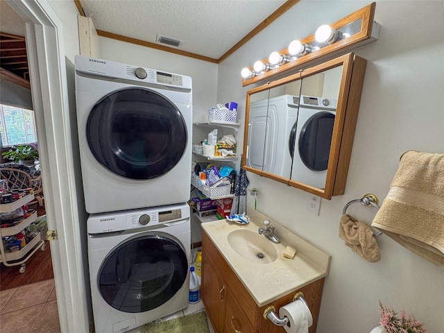 131 Ida Blvd, Interlachen, FL 32148 - washroom featuring stacked washer / drying machine, crown molding, a textured ceiling, and tile patterned floors