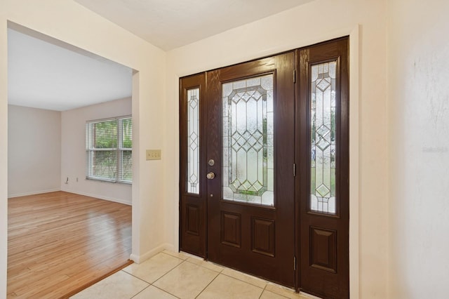 2626 NW 36th Pl, Gainesville, FL 32605 - entryway with baseboards and light wood finished floors