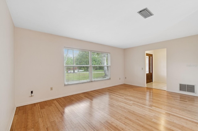2626 NW 36th Pl, Gainesville, FL 32605 - spare room featuring light wood finished floors and baseboards