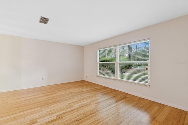 2626 NW 36th Pl, Gainesville, FL 32605 - spare room with light wood-type flooring and baseboards