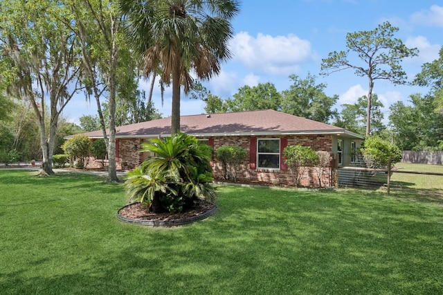 2626 NW 36th Pl, Gainesville, FL 32605 - view of front of property with brick siding and a shingled roof