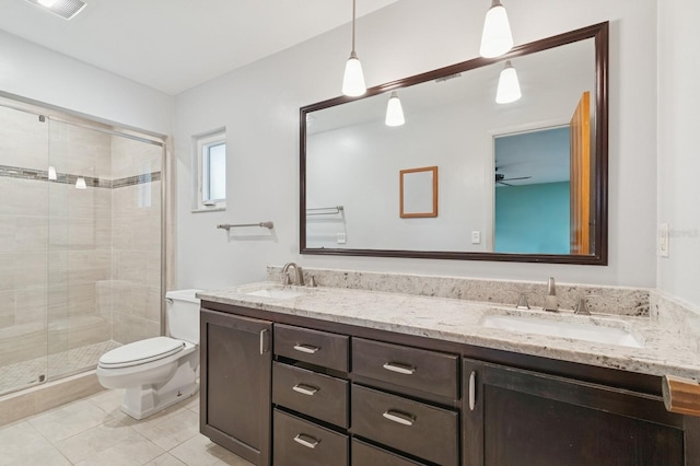 2626 NW 36th Pl, Gainesville, FL 32605 - full bath featuring double vanity, a shower stall, ceiling fan, and tile patterned flooring