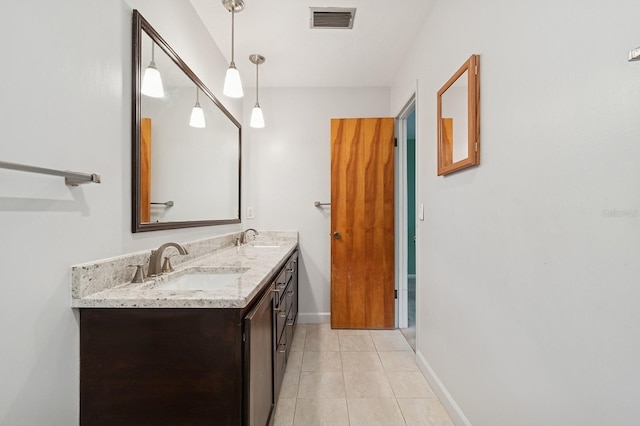 2626 NW 36th Pl, Gainesville, FL 32605 - bathroom featuring double vanity and tile patterned floors