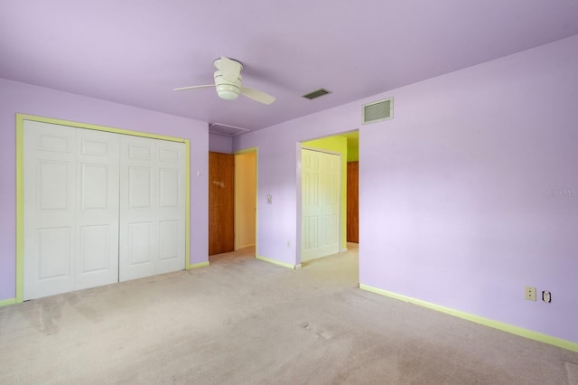 2626 NW 36th Pl, Gainesville, FL 32605 - unfurnished bedroom with carpet, a closet, and ceiling fan