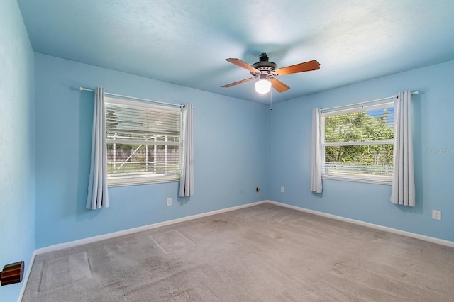 2626 NW 36th Pl, Gainesville, FL 32605 - empty room with carpet and a ceiling fan