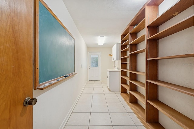 2626 NW 36th Pl, Gainesville, FL 32605 - hallway featuring light tile patterned floors and baseboards