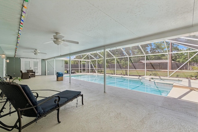 2626 NW 36th Pl, Gainesville, FL 32605 - view of pool featuring french doors, a fenced backyard, a patio area, a ceiling fan, and a pool with connected hot tub
